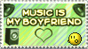 a green stamp with speakers in the background, launching a character off who keeps trying to hug them. there is white text that reads 'MUSIC IS MY BOYFRIEND' with a heart below